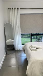 Postel nebo postele na pokoji v ubytování Ballito Escape + 8 fotografií