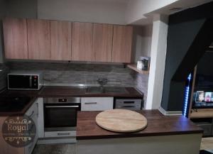 a kitchen with a wooden table on a counter at Royal in Sarajevo