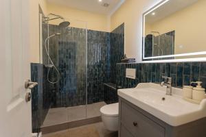 a bathroom with a toilet and a sink and a shower at Big Premium Apartment with Rhine View, totally new in Duisburg