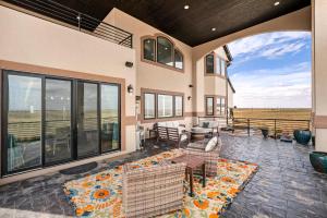 a house with a patio with a view of a field at Family Retreat W Fireplace & Patio in Hudson