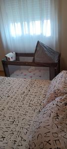 a bedroom with a bed with a comforter on it at Valparaiso8 in Oropesa del Mar