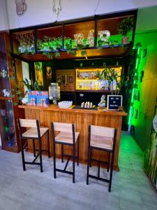 a bar with three chairs at a restaurant at Hostel Prada in Lima +59 photos