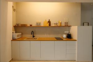 Kuchyň nebo kuchyňský kout v ubytování El Chacha Apartment
