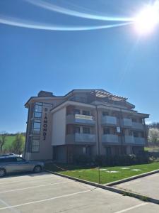 a building with a car parked in front of it at DIAMOND - Luxusný Apartmán Marco in Podhájska