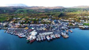 an aerial view of a harbor with boats in the water at Sweet Retreat in Castletownbere