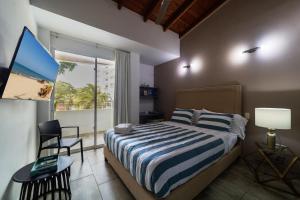 TV a/nebo společenská místnost v ubytování Hotel Boutique Casa Mar