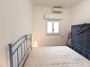 Ένα ή περισσότερα κρεβάτια σε δωμάτιο στο Villa Iris con ampia veranda
