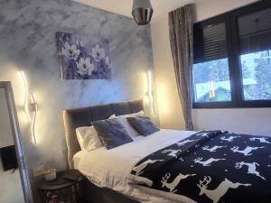 Ένα ή περισσότερα κρεβάτια σε δωμάτιο στο Apartman Ilic