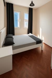 a bedroom with a large bed in a room at Holiday Home in Stylish and Peaceful Center in Kusadası