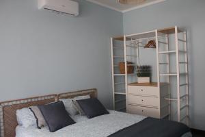 Ένα ή περισσότερα κρεβάτια σε δωμάτιο στο Casa Asterope