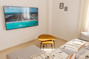 TV a/nebo společenská místnost v ubytování El Chacha Apartment