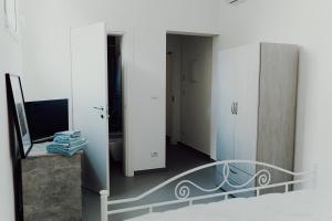 a view of a room with a staircase and a mirror at Cincin Casa in Francavilla Fontana