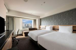 Postel nebo postele na pokoji v ubytování ANA Crowne Plaza Sapporo by IHG