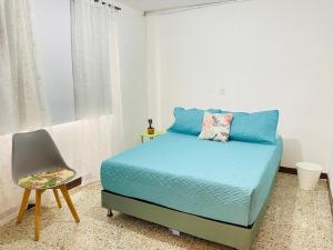 Katil atau katil-katil dalam bilik di Casa de las Flores en Medellín