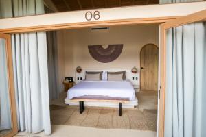 Postel nebo postele na pokoji v ubytování Hotel Tahiti