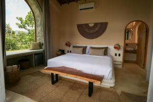 Postel nebo postele na pokoji v ubytování Hotel Tahiti
