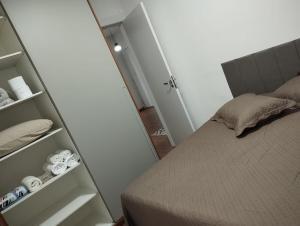 Postel nebo postele na pokoji v ubytování Rose Prime Loft