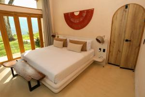 Postel nebo postele na pokoji v ubytování Hotel Tahiti