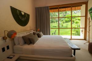 Postel nebo postele na pokoji v ubytování Hotel Tahiti