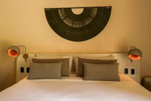 Postel nebo postele na pokoji v ubytování Hotel Tahiti