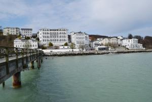a bridge over a body of water with buildings at Fürstenhof Sassnitz in Sassnitz