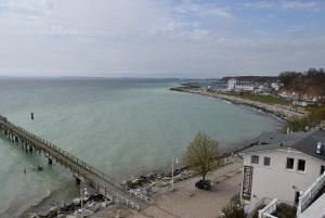 a view of a body of water with a pier at Fürstenhof Sassnitz in Sassnitz