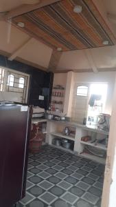 a kitchen with a sink and a counter top at Kheya Kutir in Shānti Niketan