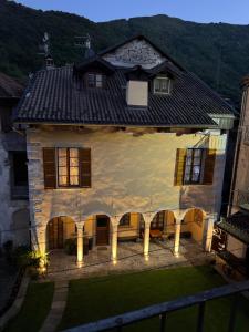 an aerial view of a house with lights at Plaza Apartment in Cannobio