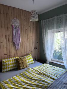 Afbeelding uit fotogalerij van Domek letniskowy "Pod dębem" in Urowo