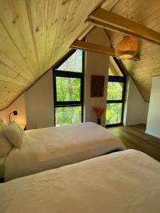 Ένα ή περισσότερα κρεβάτια σε δωμάτιο στο elements - Solina, z sauną