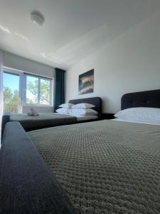 Postel nebo postele na pokoji v ubytování Starigrad Paklenica-Josipa apartmani