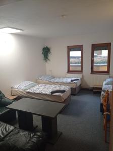 Postel nebo postele na pokoji v ubytování Penzion Pralinka