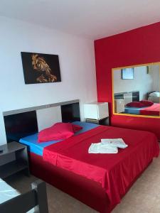 Ένα ή περισσότερα κρεβάτια σε δωμάτιο στο Pousada Maria Bonita