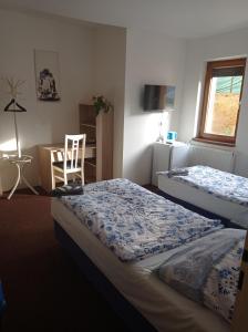 Postel nebo postele na pokoji v ubytování Penzion Pralinka