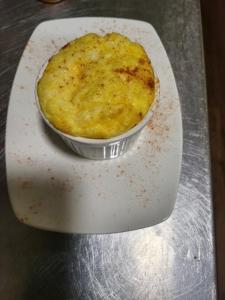 a piece of food in a container on a table at Chilverton Cottages in Ravenshoe