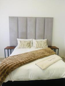 Ένα ή περισσότερα κρεβάτια σε δωμάτιο στο Bay Family Nest