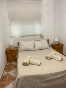 Ένα ή περισσότερα κρεβάτια σε δωμάτιο στο Rosan 1