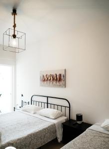 Postel nebo postele na pokoji v ubytování Asteria House