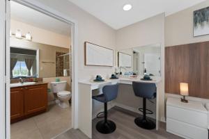 a bathroom with a vanity and a toilet and a sink at 2 Units Together Kitchen Great Location in Orlando