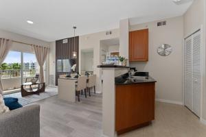 a kitchen and living room with a table and a counter at 2 Units Together Kitchen Great Location in Orlando +18 photos
