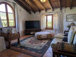 a living room with a couch and a tv at Ca'n Josep in Segorbe