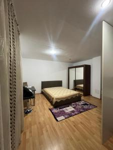 a bedroom with a bed and a mirror at Studio Chic in Bucharest
