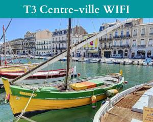a yellow and green boat is docked in a harbor at St Martial Sète centre, CLIM in Sète