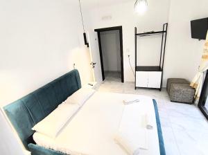 Postel nebo postele na pokoji v ubytování Sunset Hotel