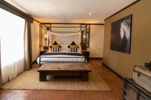 Postel nebo postele na pokoji v ubytování Hacienda El Salitre Hotel & Spa