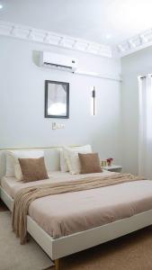 Ένα ή περισσότερα κρεβάτια σε δωμάτιο στο La maison d'Emma