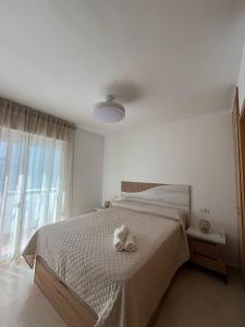 Postel nebo postele na pokoji v ubytování Apartamento cerca del Mar, Layma