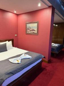 Letto o letti in una camera di Hotel Astra