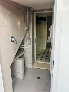 a bathroom with a walk in shower and a mirror at A due passi dal mare in Santa Marinella +19 photos