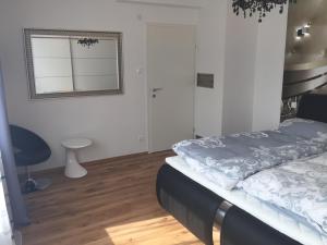 Ein Bett oder Betten in einem Zimmer der Unterkunft Enjoyit-WS